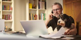 Man at desk with pet